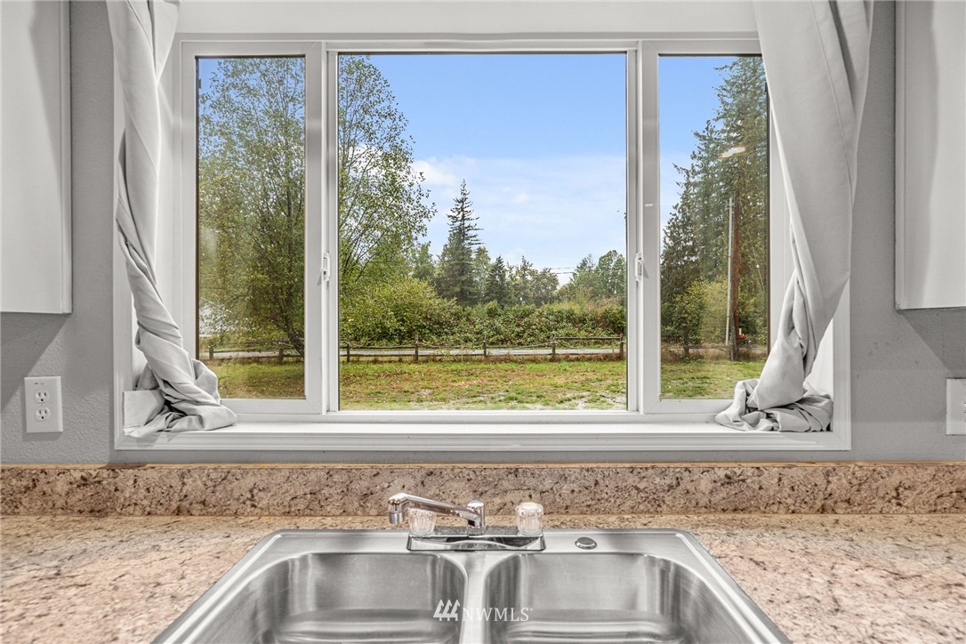 40822 Dorman Road Gold Bar, WA 98251 - Photo 6 of 34 a view of a sink and a granite countertop next to a window