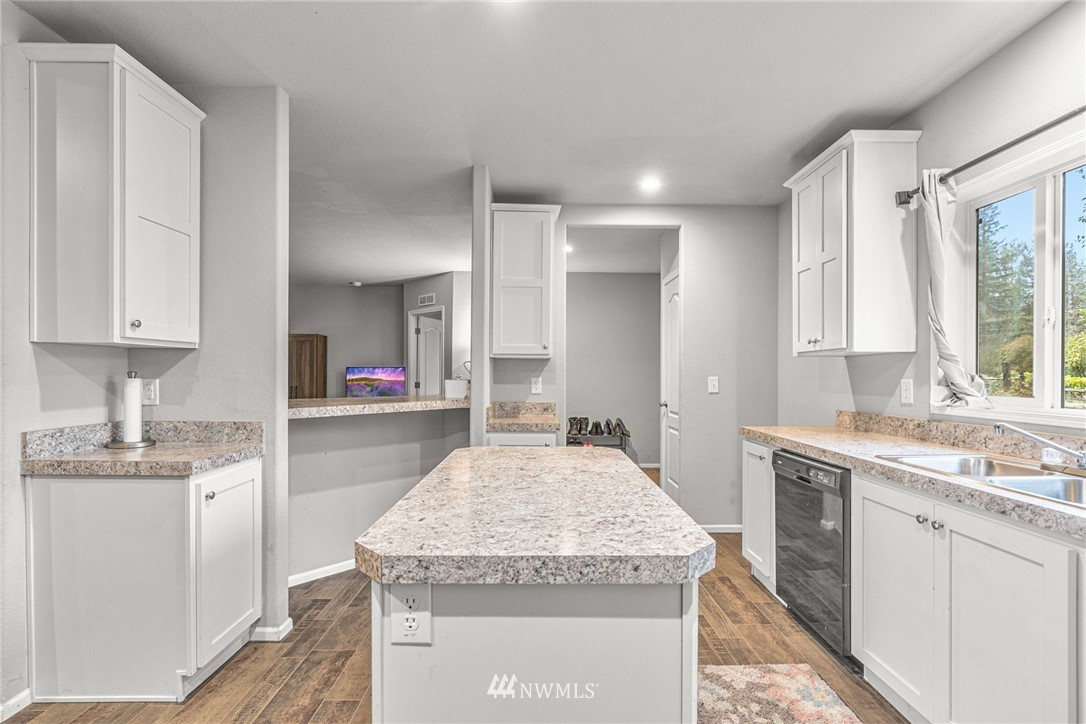 40822 Dorman Road Gold Bar, WA 98251 - Photo 10 of 34 a kitchen with granite countertop kitchen island a sink appliances and cabinets