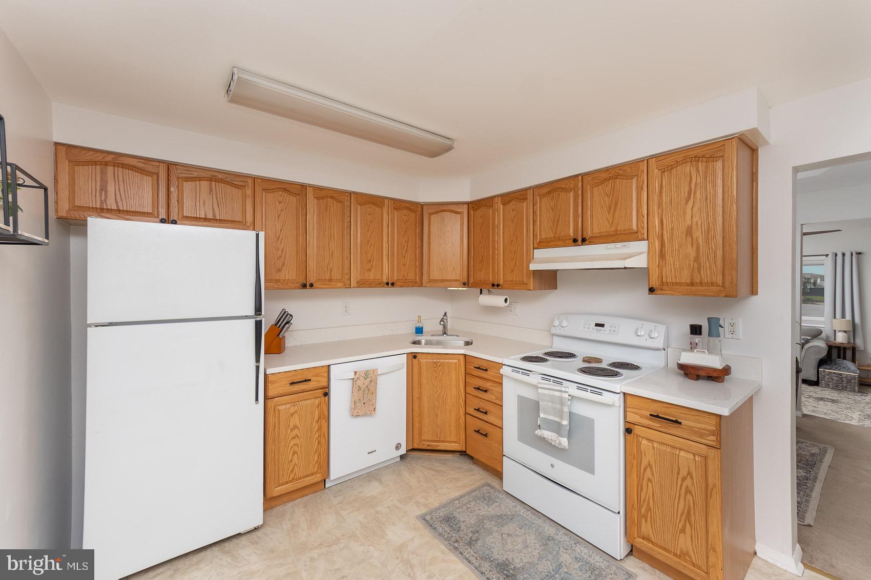 706 Riley Court Westminster, MD 21158 - Photo 19 of 61 Open Eat-In Kitchen with white appliances.