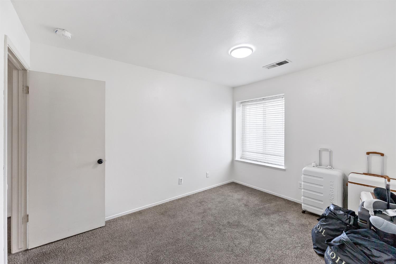 398 Helena Way Madera, CA 93637 - Photo 11 of 23 a view of a room with windows and cabinet