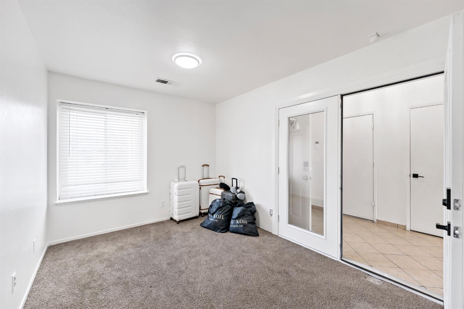 398 Helena Way Madera, CA 93637 - Photo 12 of 23 a room with closet and a window