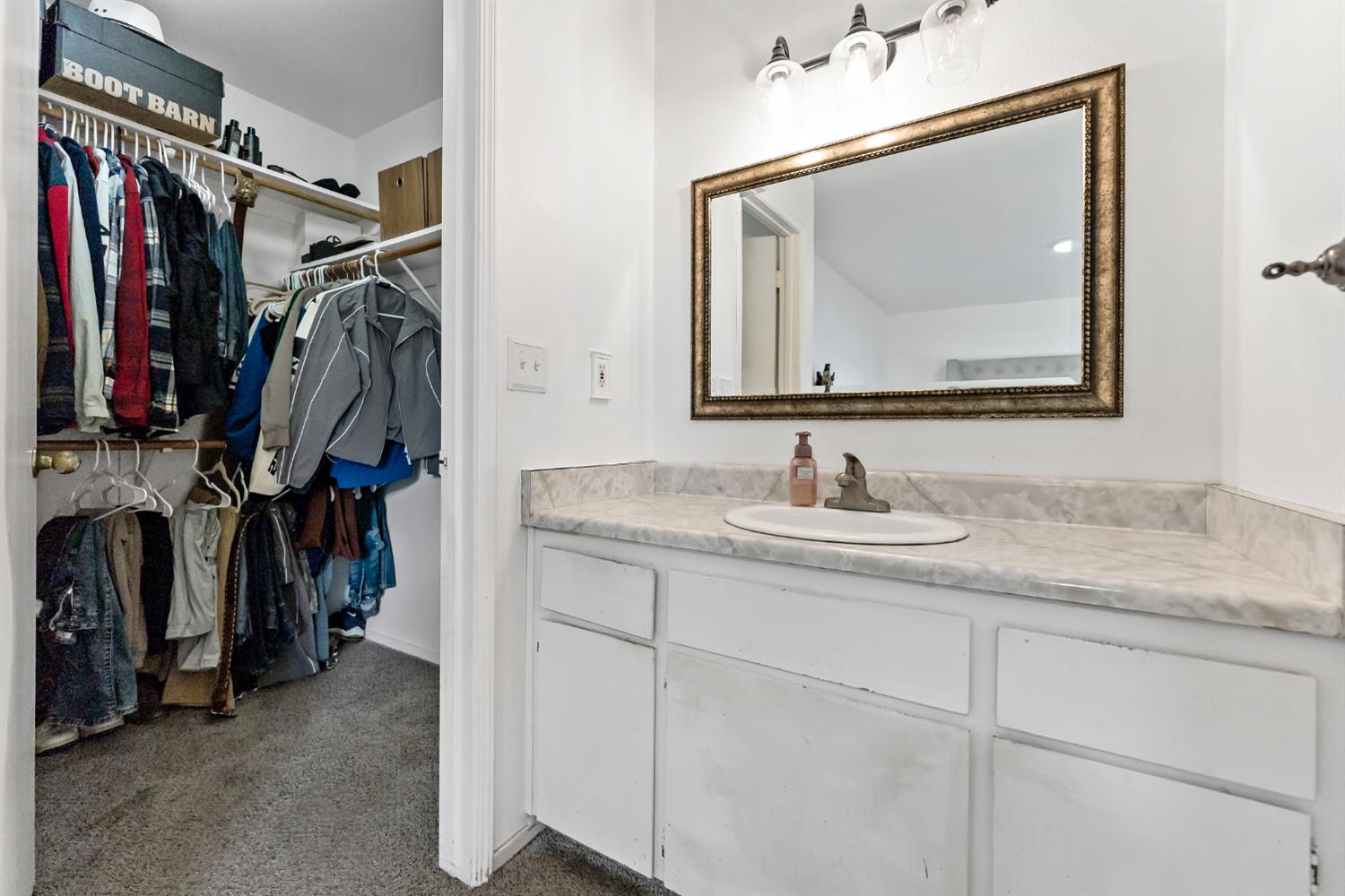398 Helena Way Madera, CA 93637 - Photo 19 of 23 a bathroom with a sink vanity and a mirror