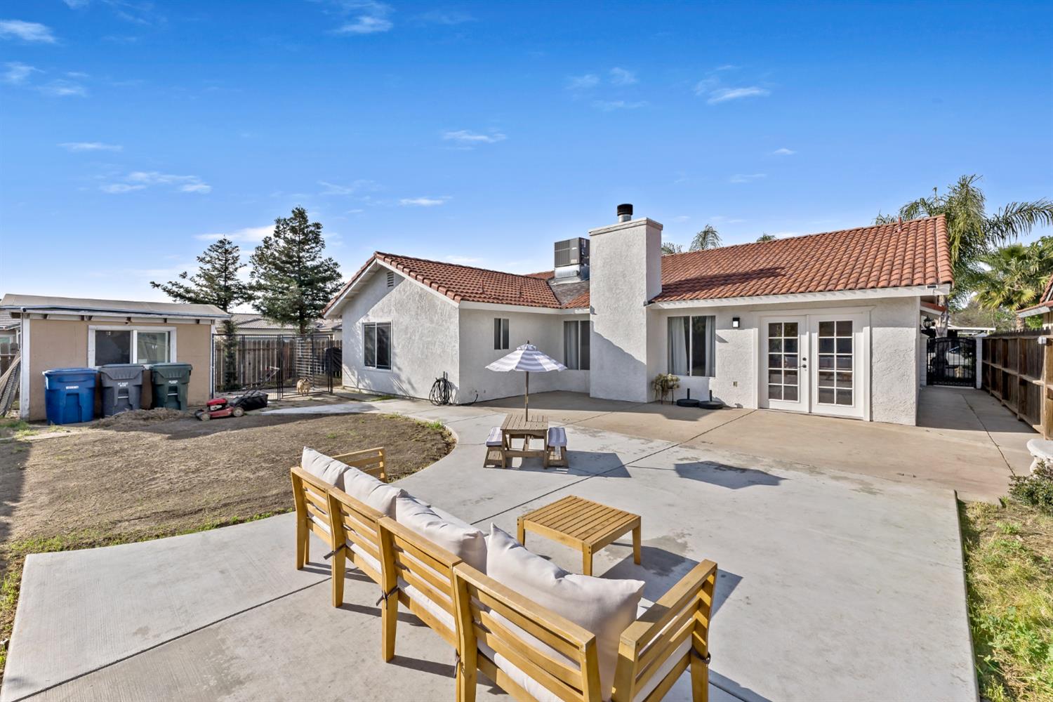 398 Helena Way Madera, CA 93637 - Photo 22 of 23 a view of a house with swimming pool and sitting area