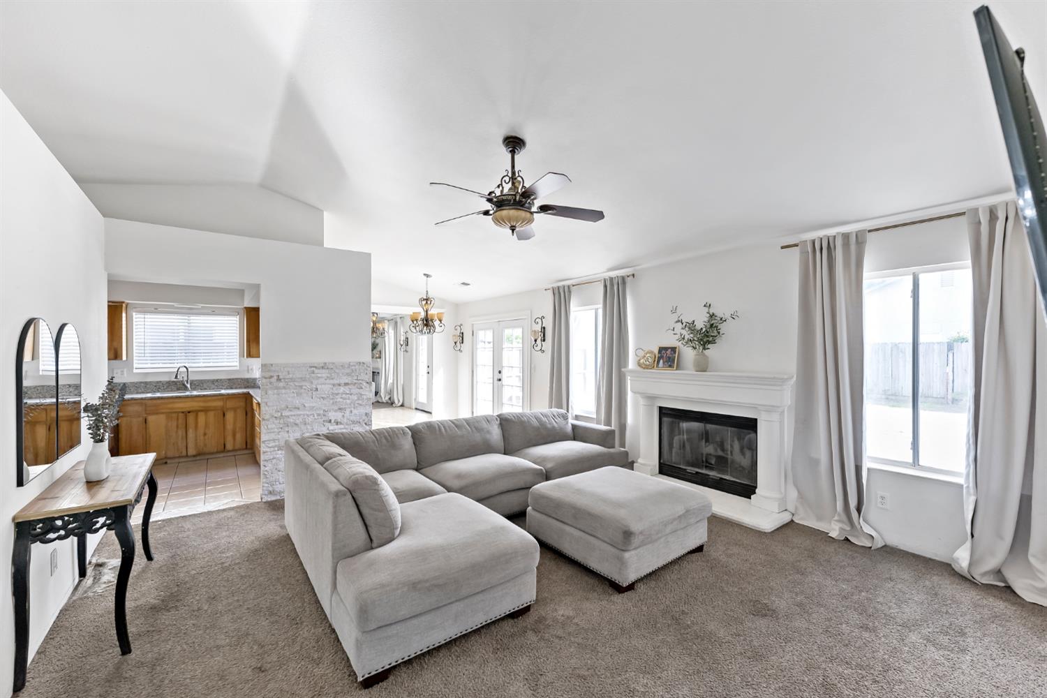 398 Helena Way Madera, CA 93637 - Photo 3 of 23 a living room with furniture fireplace and window
