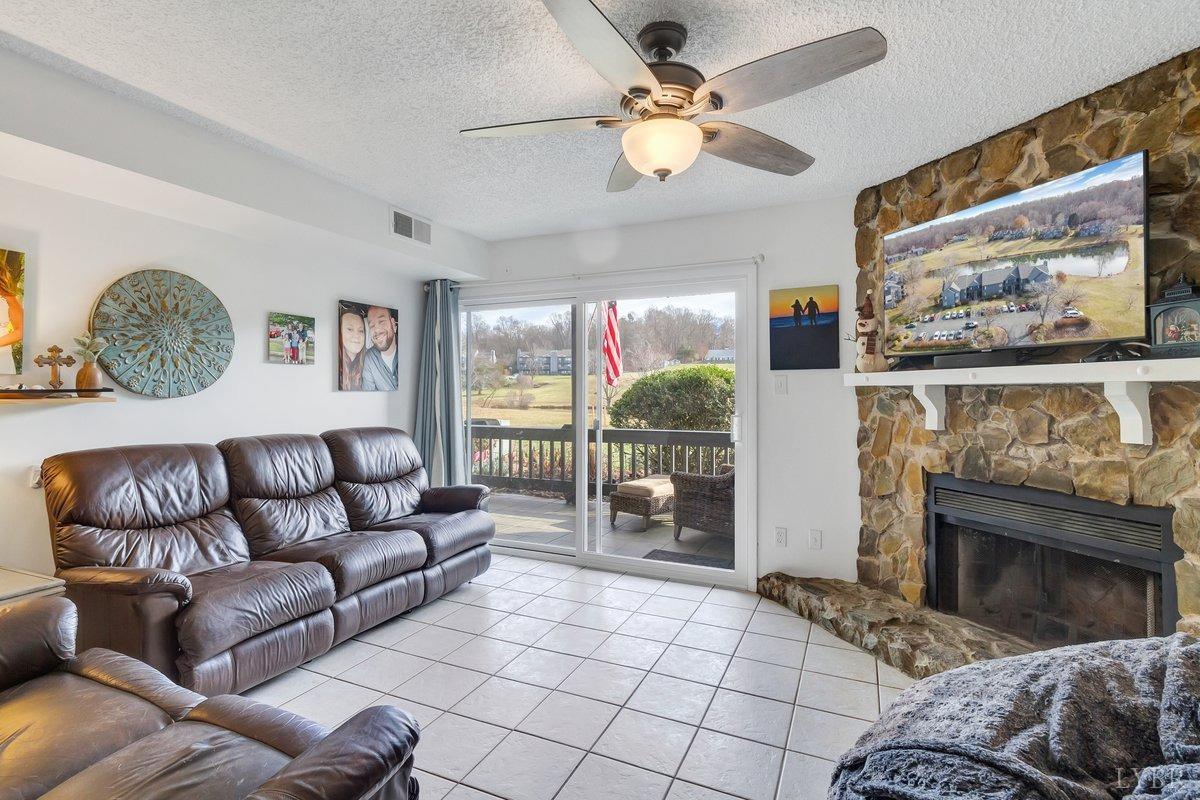 2404 Deer Run Forest, VA 24551 - Photo 12 of 32 a living room with furniture and a fireplace