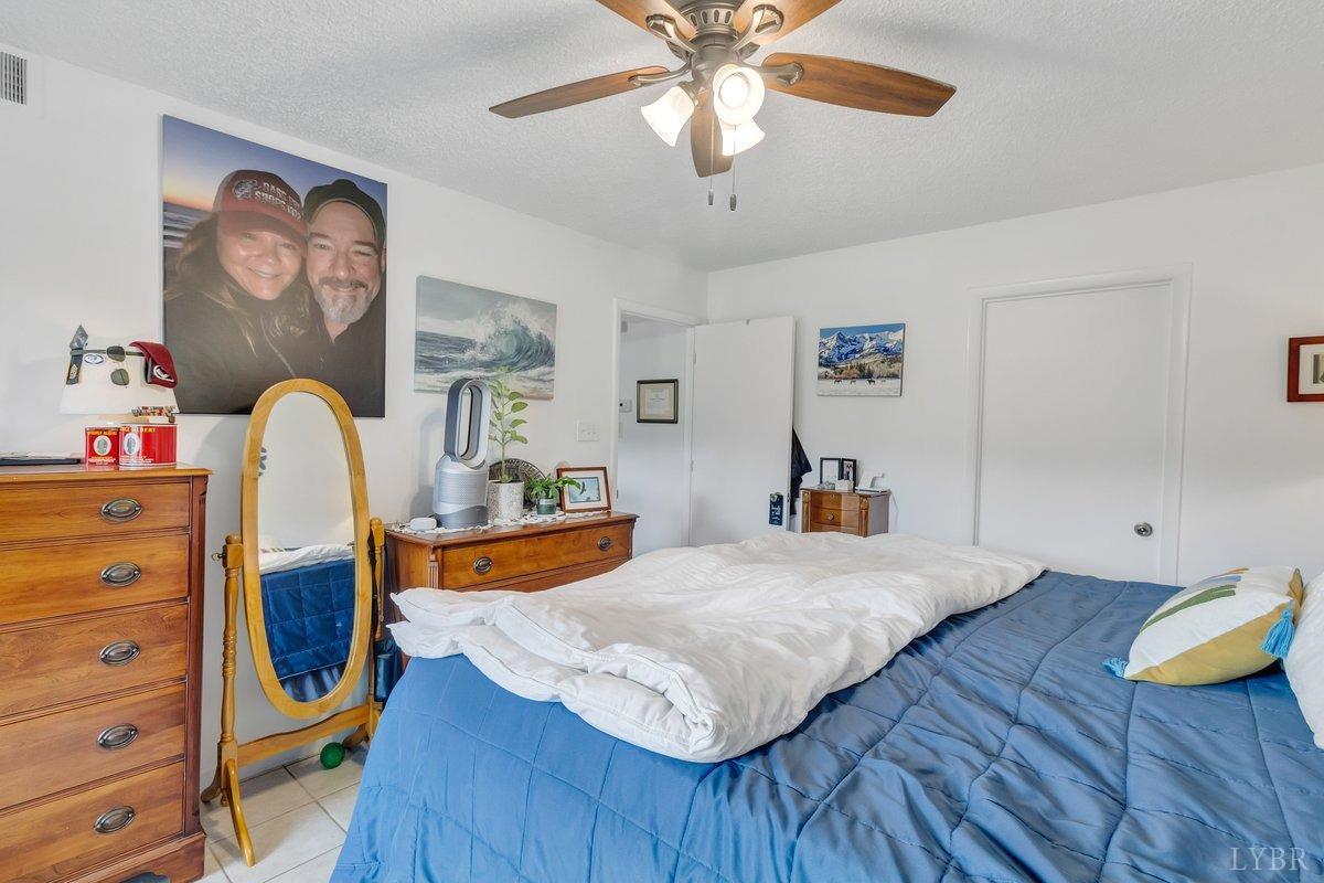 2404 Deer Run Forest, VA 24551 - Photo 17 of 32 a bedroom with a bed and wooden floor