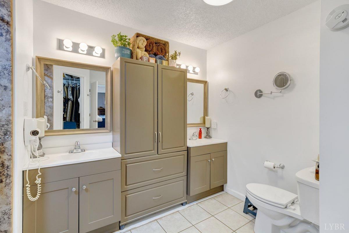 2404 Deer Run Forest, VA 24551 - Photo 19 of 32 a bathroom with a sink a toilet and shower