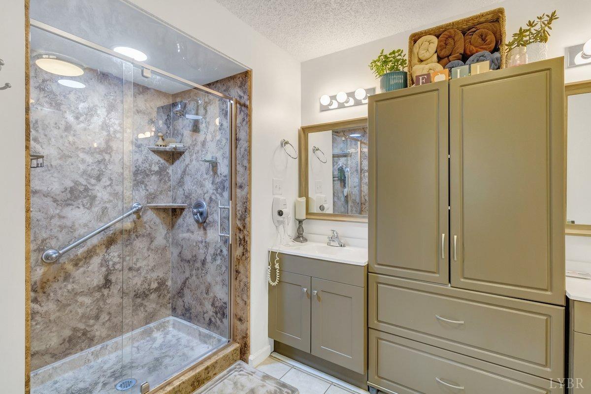 2404 Deer Run Forest, VA 24551 - Photo 20 of 32 a bathroom with a shower and a sink