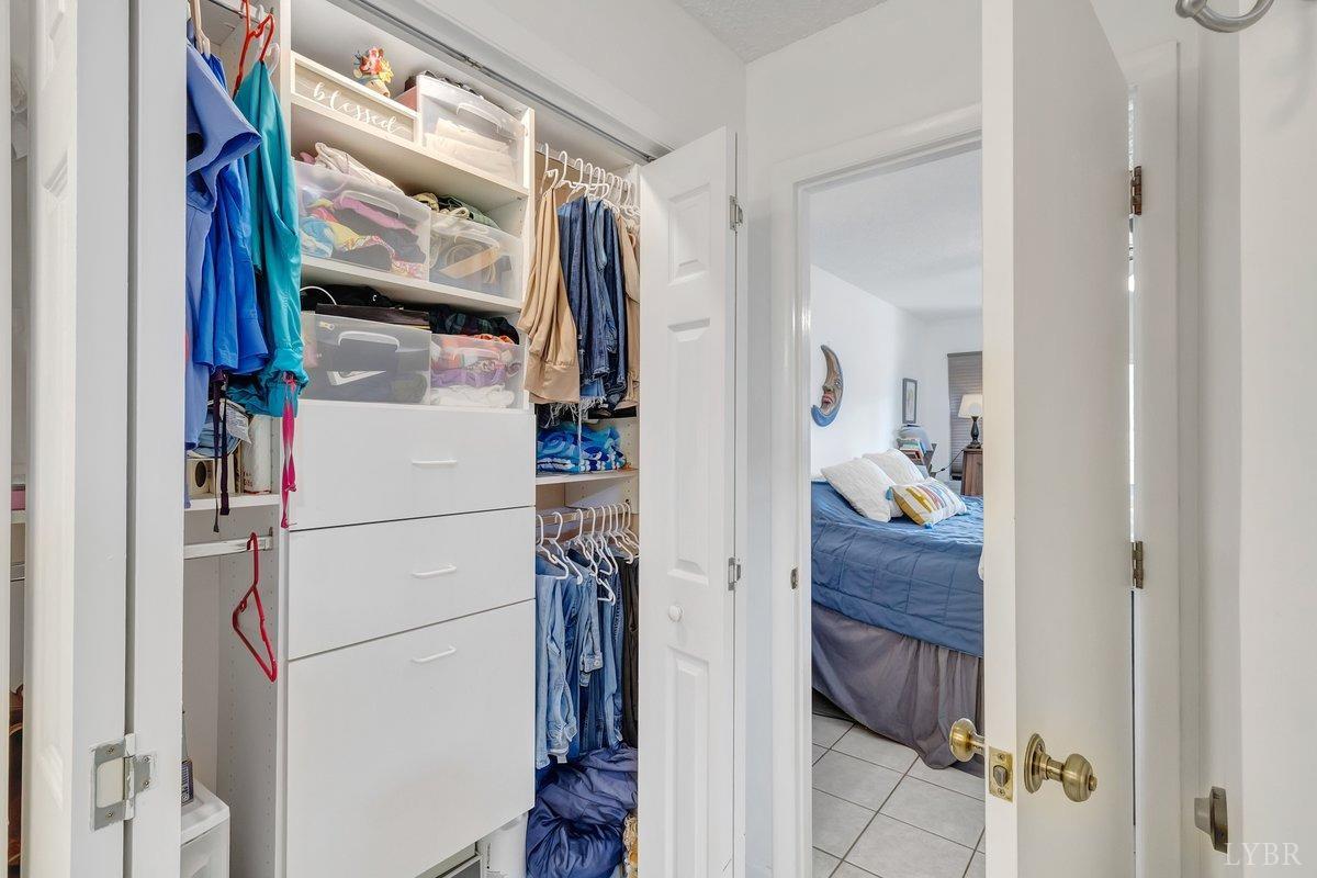 2404 Deer Run Forest, VA 24551 - Photo 22 of 32 a view of walk in closet with clothes and shoes