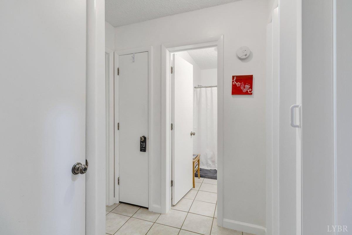 2404 Deer Run Forest, VA 24551 - Photo 23 of 32 a view of a hallway with wooden shelves