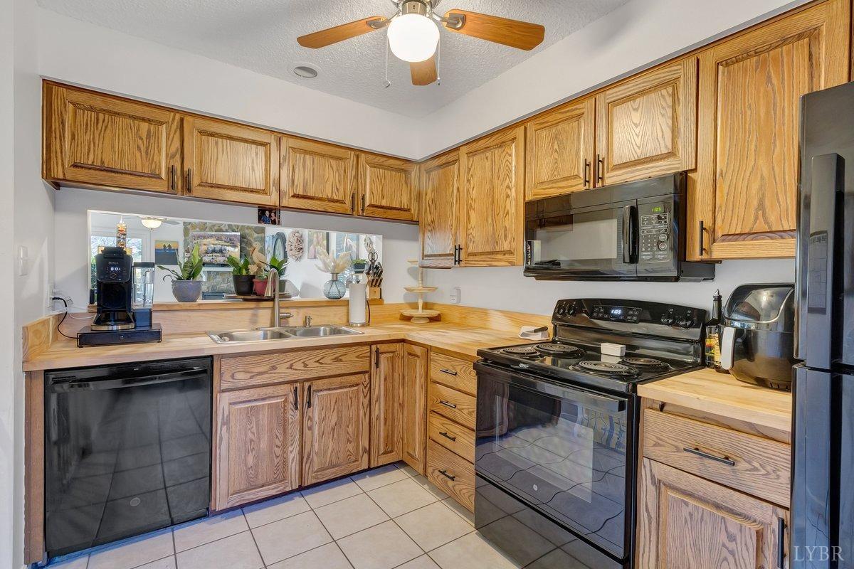 2404 Deer Run Forest, VA 24551 - Photo 5 of 32 a kitchen with a sink stove top oven and microwave