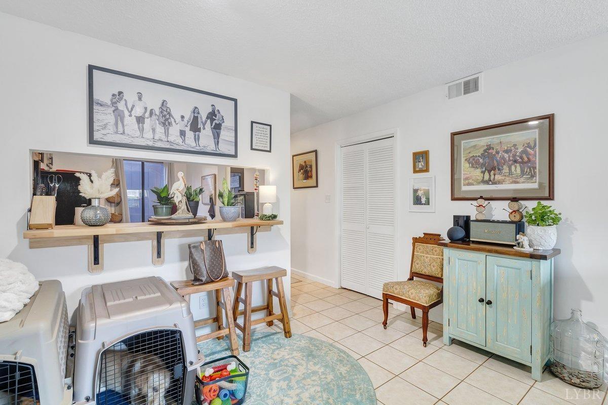 2404 Deer Run Forest, VA 24551 - Photo 10 of 32 a living room with furniture and paintings on the wall