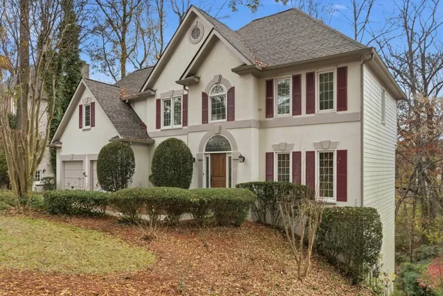 a front view of a house with garden
