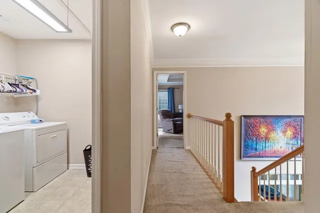 a bedroom with a bed and large windows