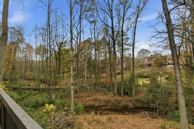 a front view of a house with a yard and balcony