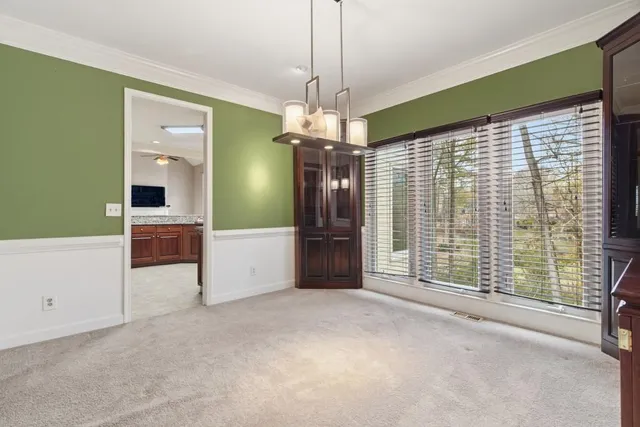 a kitchen with stainless steel appliances granite countertop a stove sink and cabinets