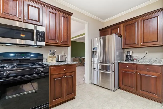 a large bathroom with a granite countertop sink and a large mirror