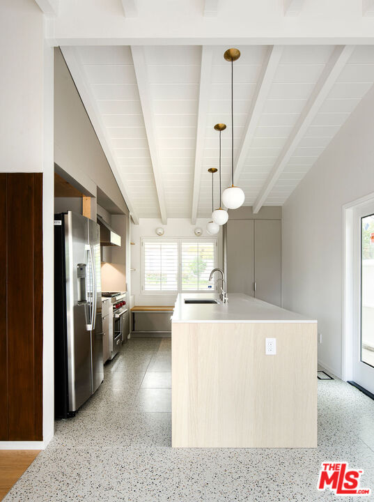 11368 Berwick Street Los Angeles, CA 90049 - Photo 11 of 27 a large white kitchen with a large window