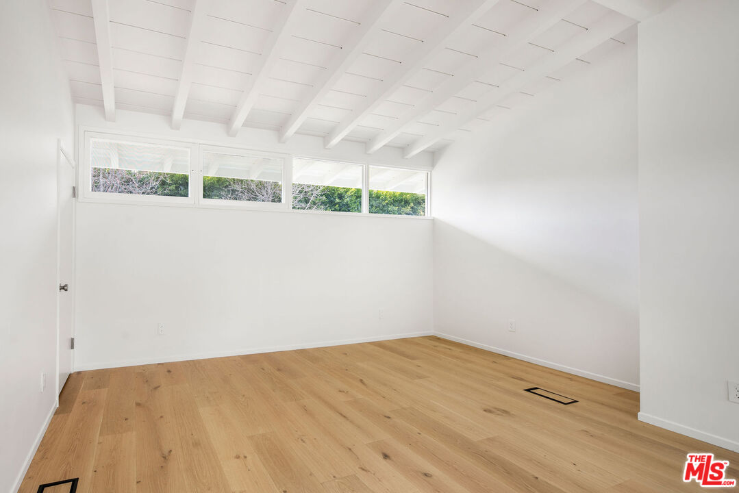 11368 Berwick Street Los Angeles, CA 90049 - Photo 21 of 27 a view of a room with wooden floor