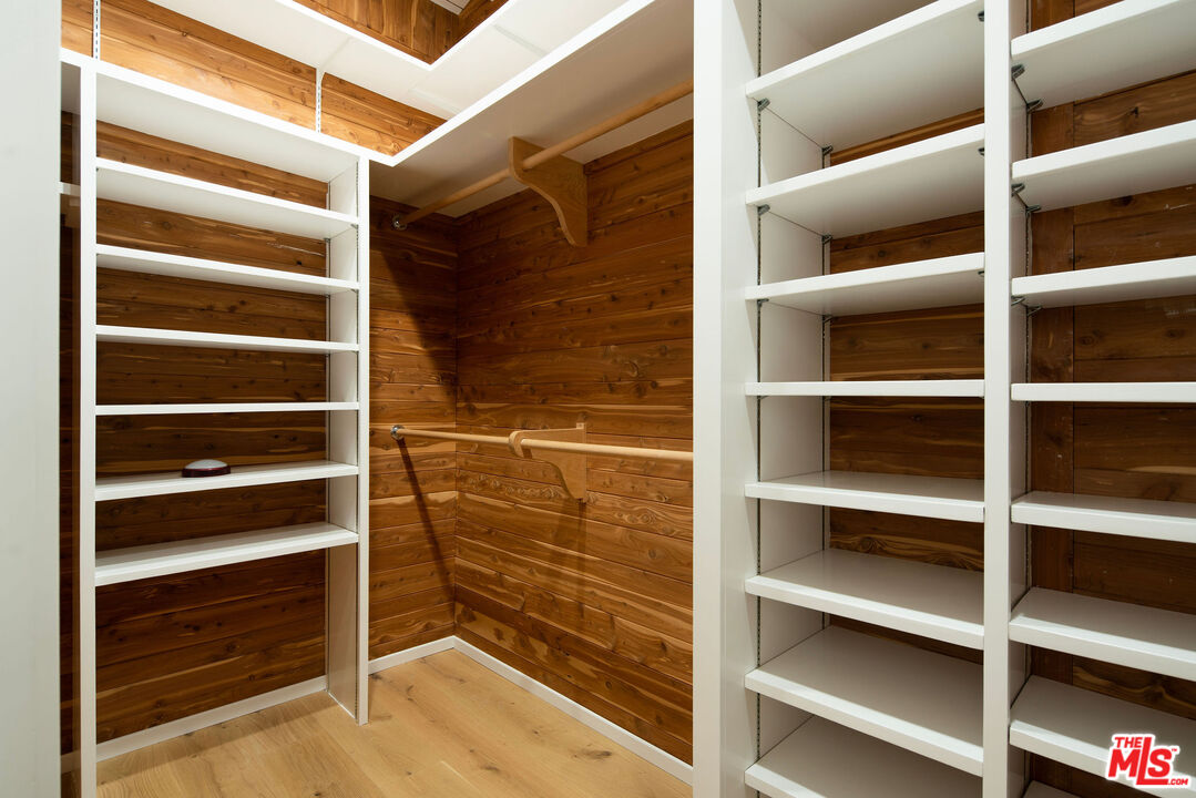 11368 Berwick Street Los Angeles, CA 90049 - Photo 22 of 27 a view of walk in closet with empty racks