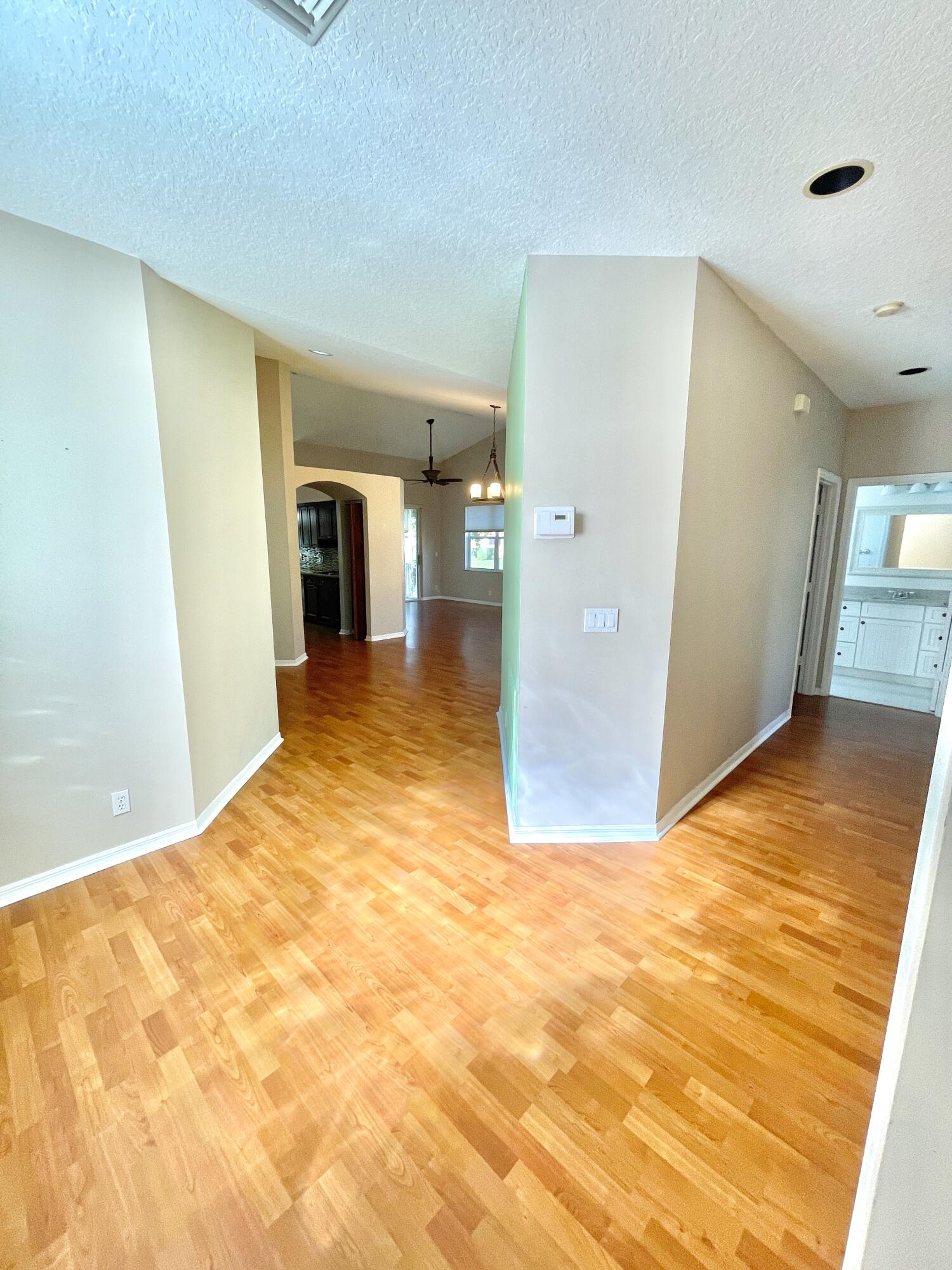8550 Vía Romana, Unit 2 Boca Raton, FL 33496 - Photo 5 of 28 a view of a big room with wooden floor and a bathroom