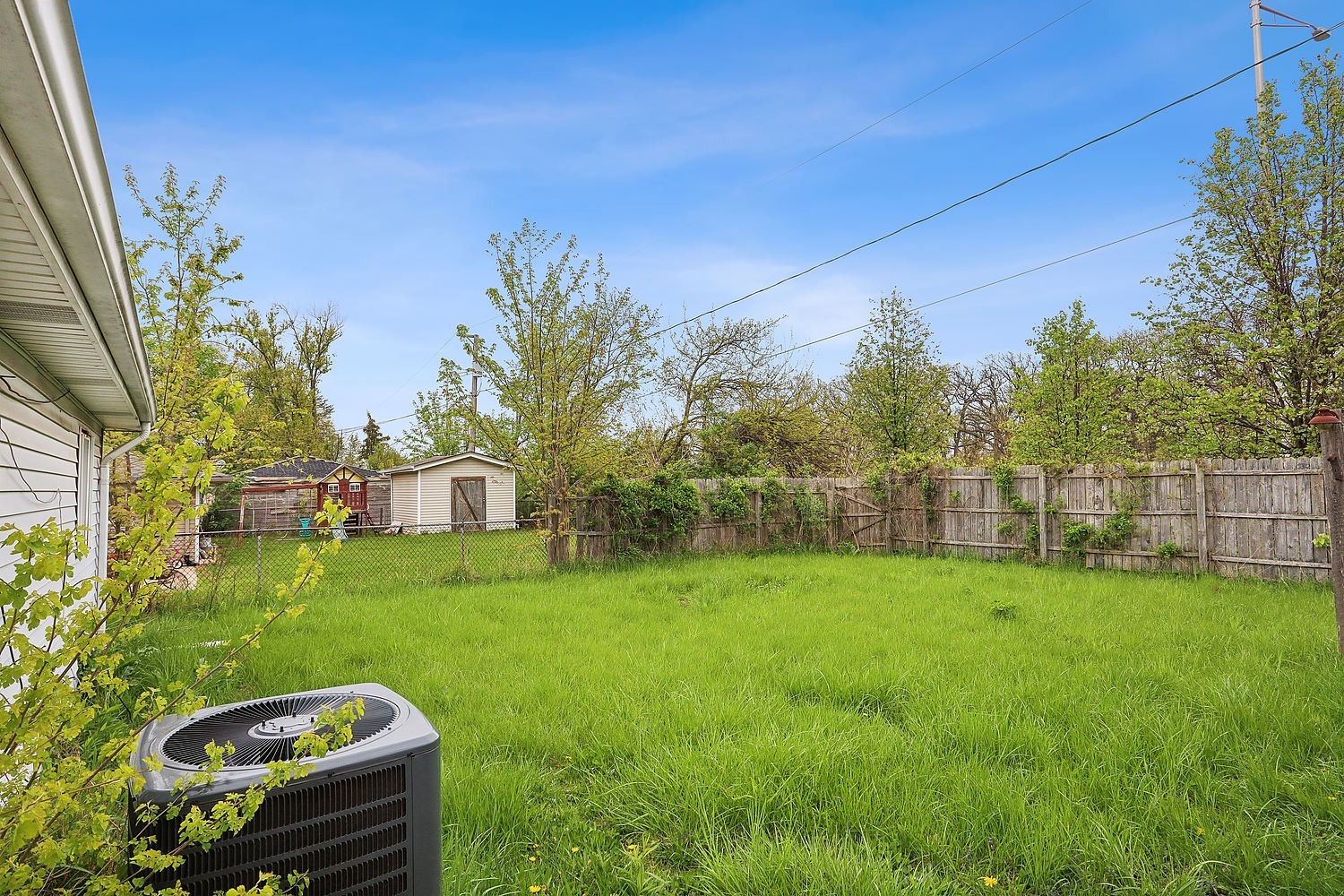 26835 South Linden Lane Crete, IL 60417 - Photo 13 of 13 a view of a backyard with couches under an umbrella