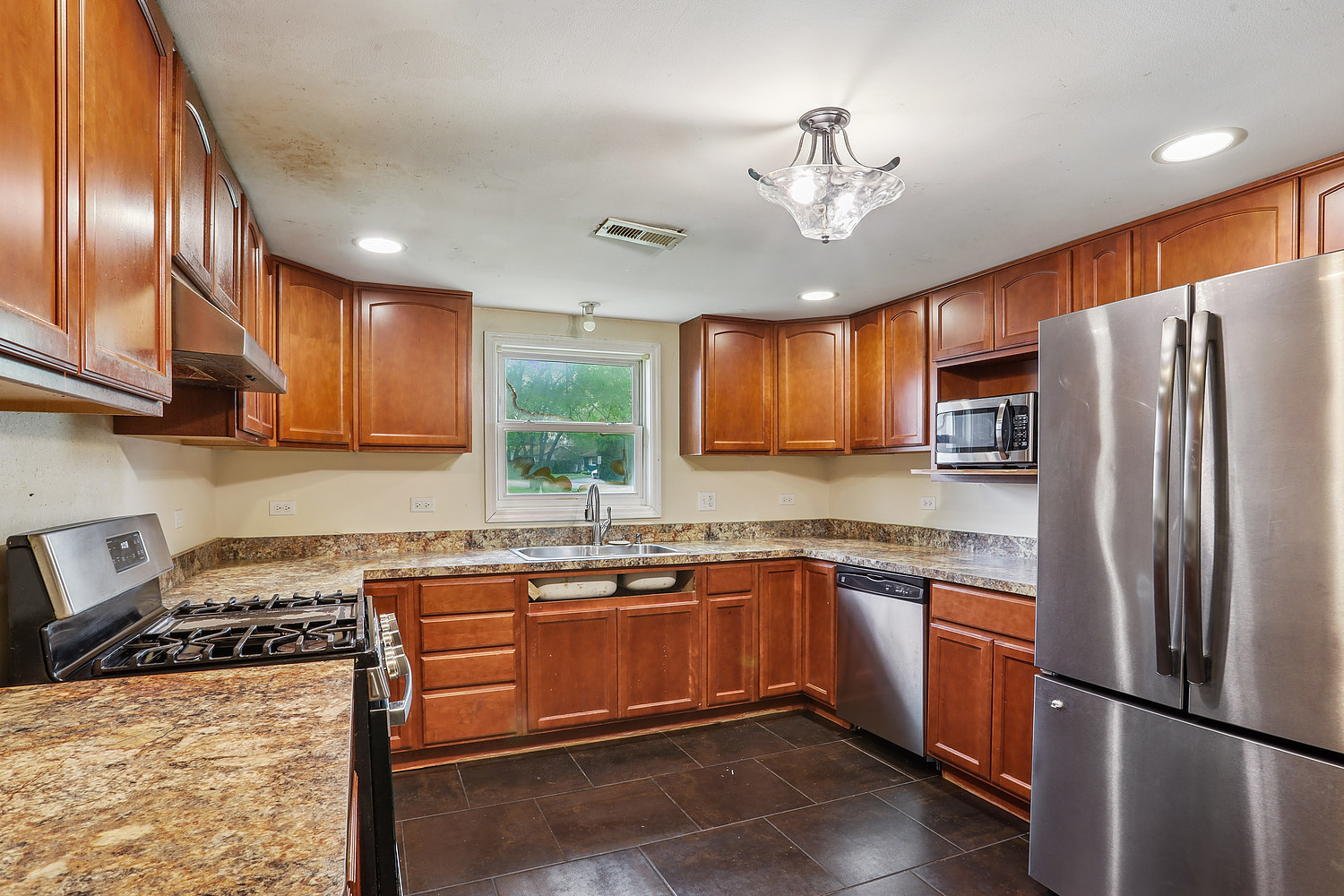 26835 South Linden Lane Crete, IL 60417 - Photo 3 of 13 a kitchen with stainless steel appliances granite countertop a sink stove and refrigerator