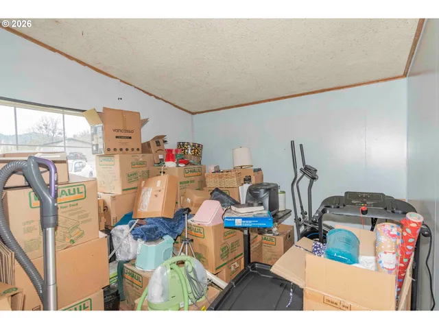 a view of a dining room with furniture and a chandelier