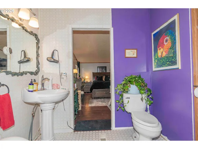 a balcony with wooden floor and outdoor seating