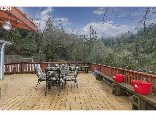a view of a park with iron fence