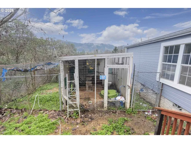 a view of a yard with an outdoor seating