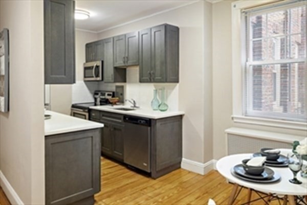 52 Strathmore Road, Unit 25 Boston, MA 02135 - Photo 4 of 12 a kitchen with a sink and cabinets