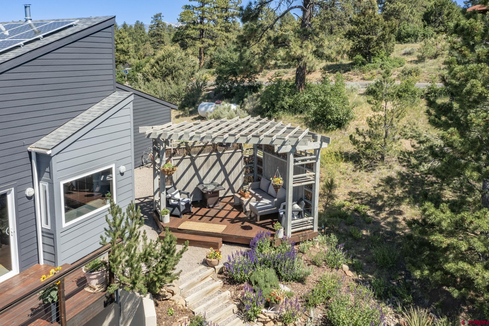 1584 Ridge Road Durango, CO 81303 - Photo 32 of 35 a view of a patio with table and chairs and potted plants