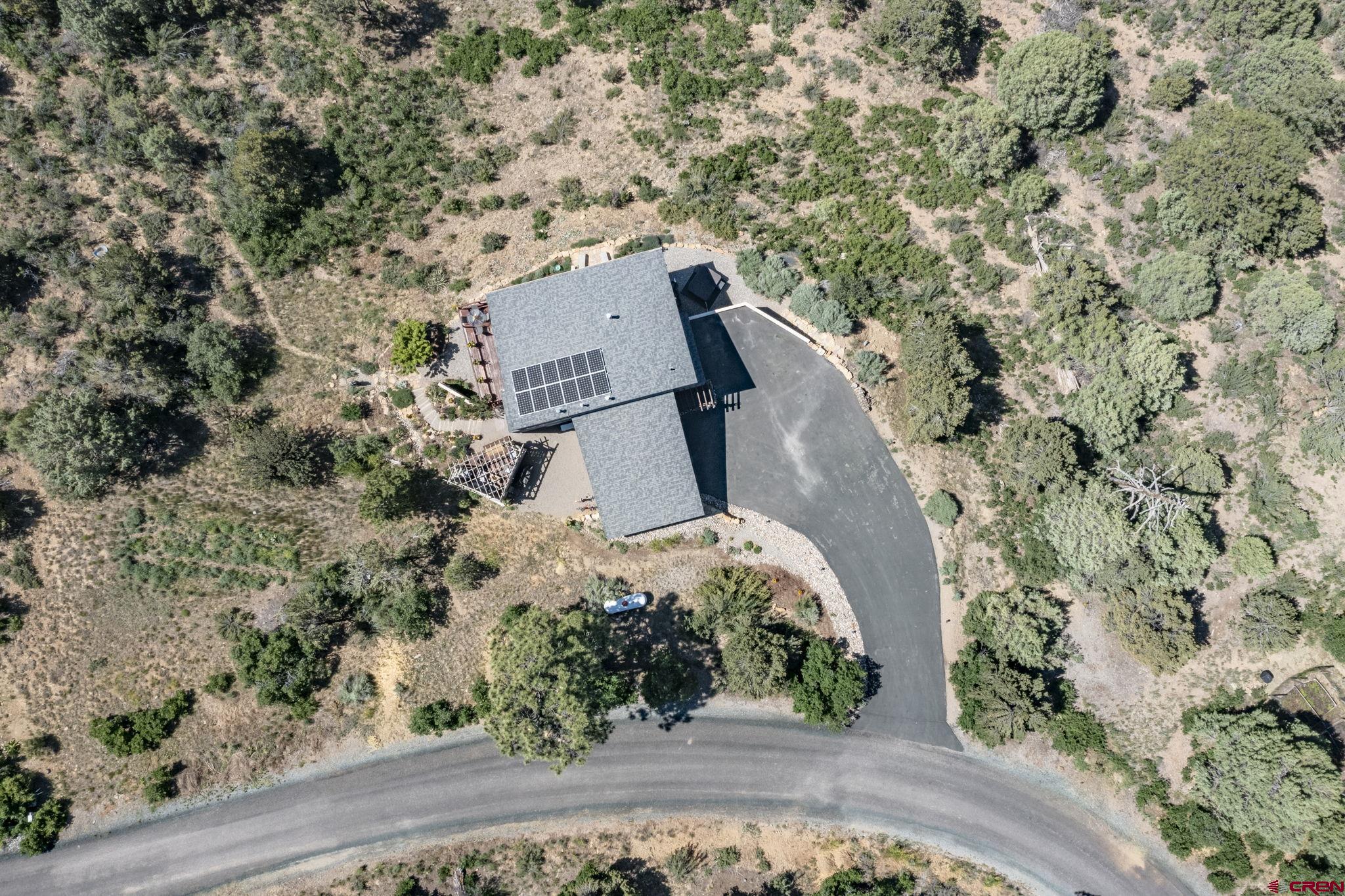 1584 Ridge Road Durango, CO 81303 - Photo 34 of 35 an aerial view of a house with a yard and trees