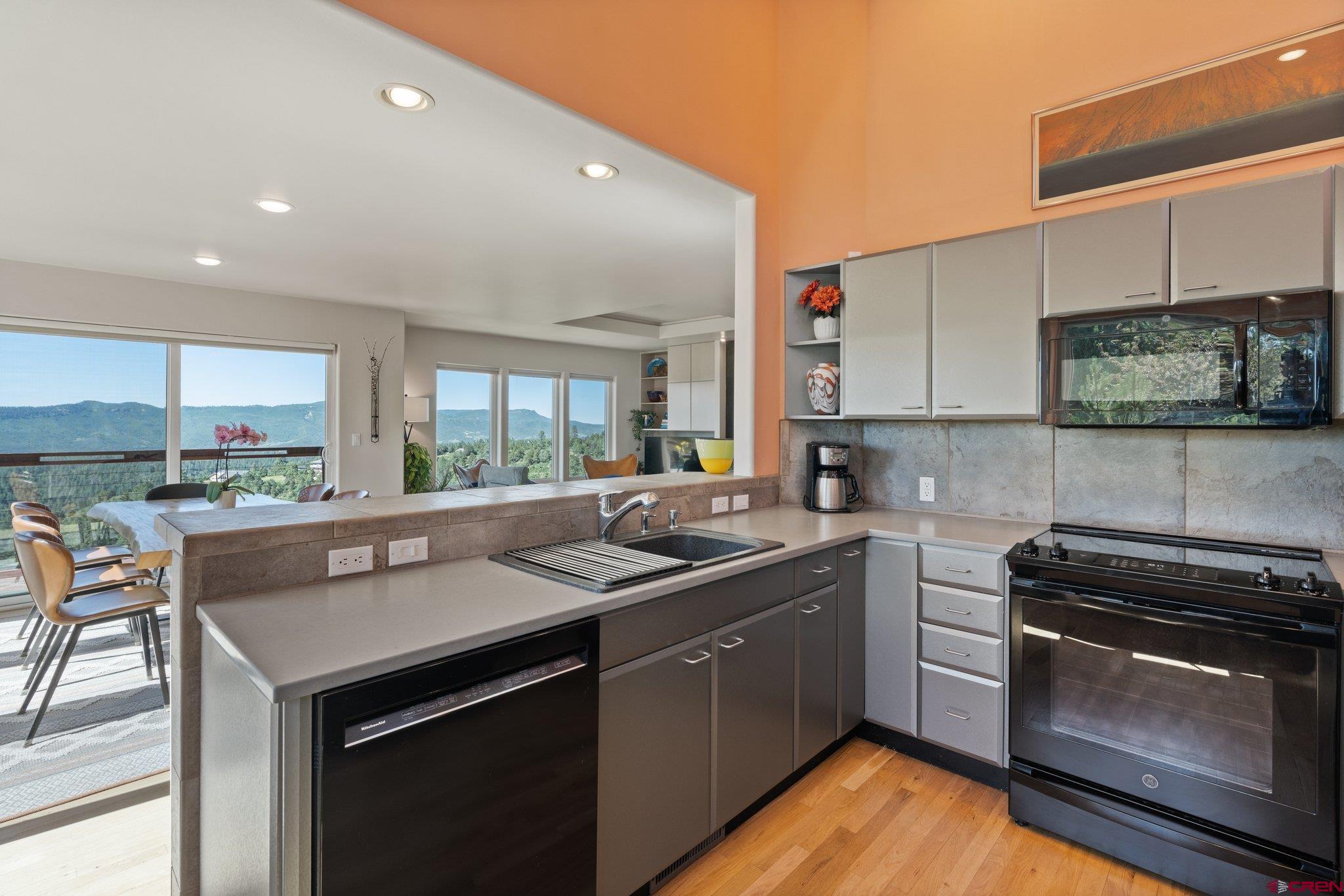 1584 Ridge Road Durango, CO 81303 - Photo 5 of 35 a kitchen with a sink a stove and cabinets