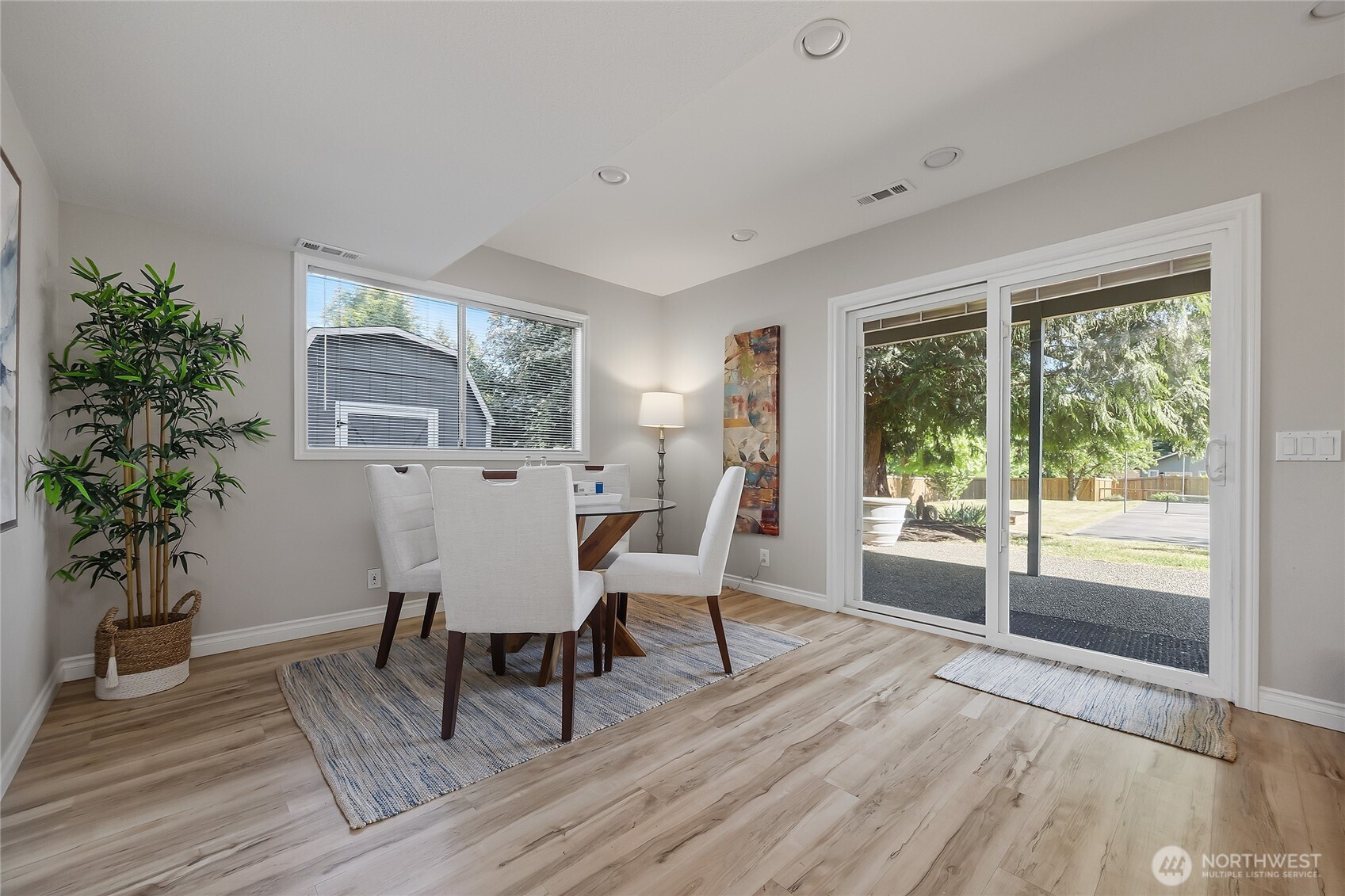 23707 Meridian Place West Bothell, WA 98021 - Photo 28 of 40 a view of a dining room with furniture window and wooden floor
