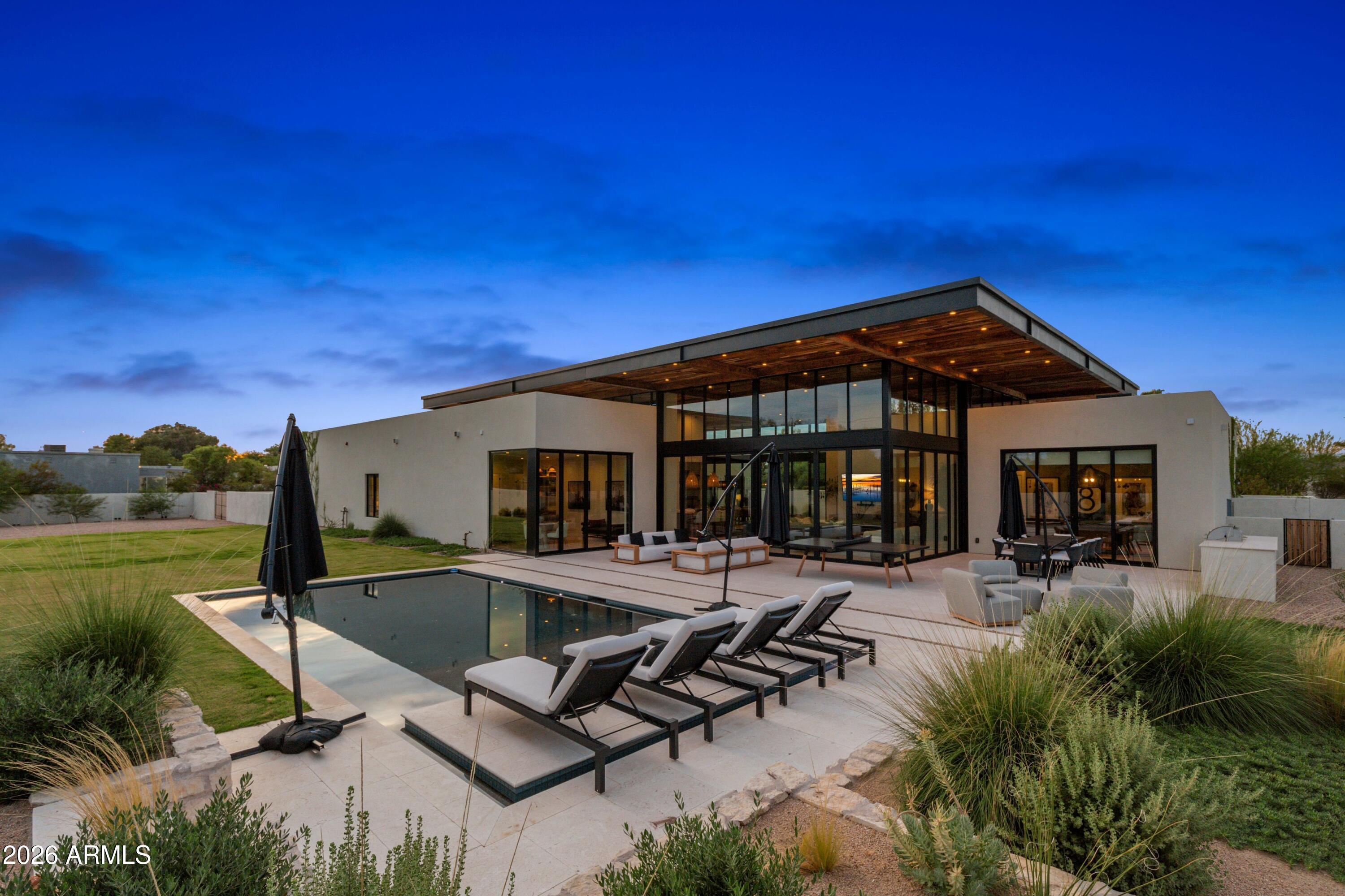 8307 East Gary Road Scottsdale, AZ 85260 - Photo 30 of 34 a front view of house with yard and outdoor seating