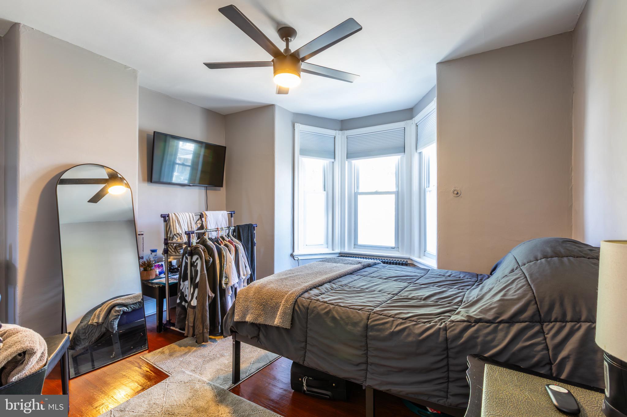 4360 Pechin Street Philadelphia, PA 19128 - Photo 18 of 40 a bed sitting in a bedroom next to a window