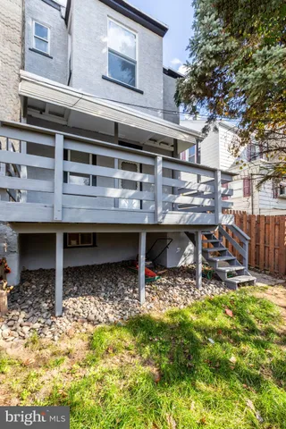 a view of storage and utility room with wooden floor