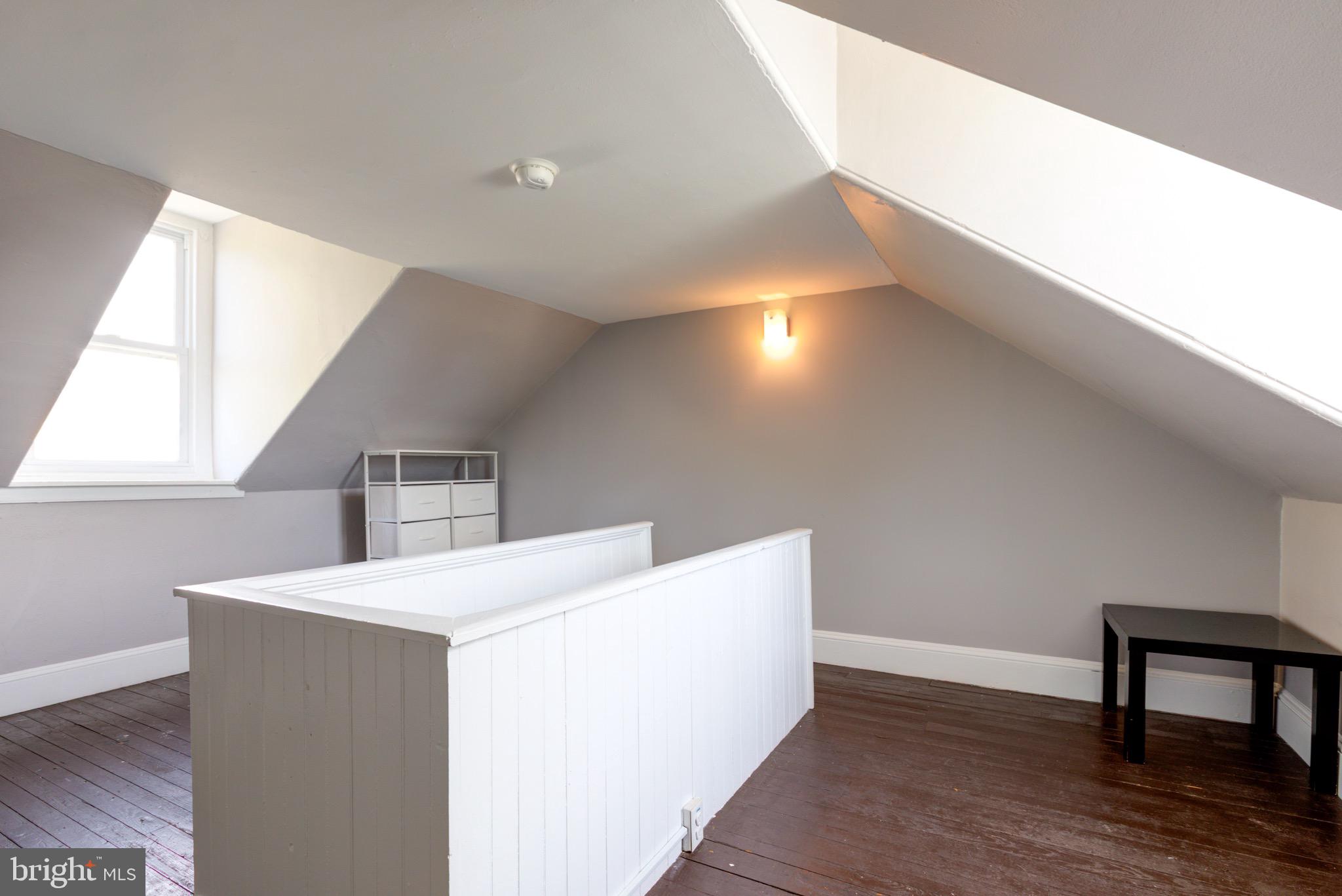 4360 Pechin Street Philadelphia, PA 19128 - Photo 35 of 40 a view of an empty room with wooden floor and a window