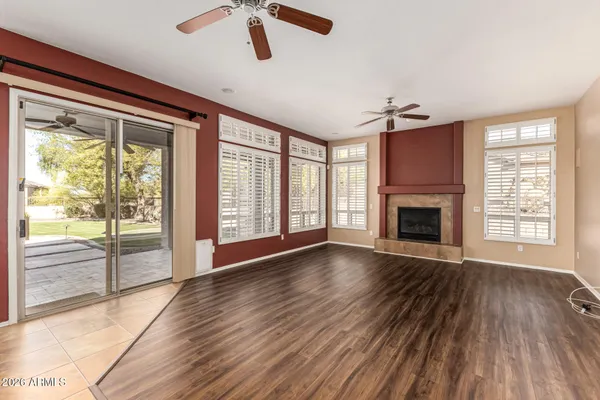 a large kitchen with stainless steel appliances kitchen island granite countertop a refrigerator and stove top oven
