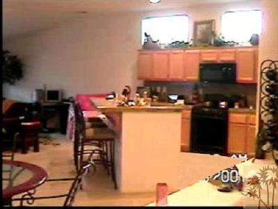 47750 Mirage Way Indio, CA 92201 - Photo 14 of 26 a kitchen with a sink and cabinets