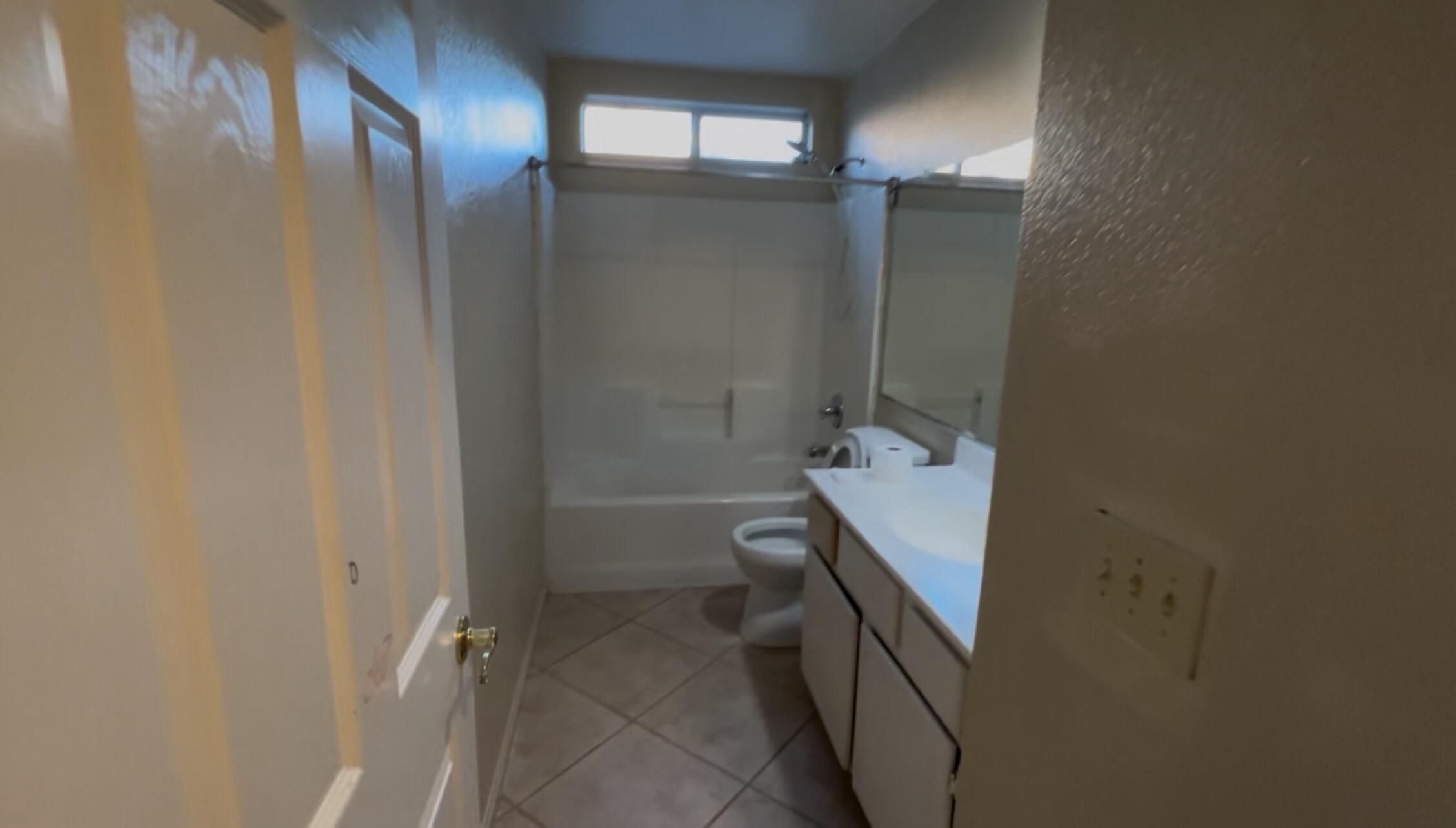47750 Mirage Way Indio, CA 92201 - Photo 20 of 26 a bathroom with a granite countertop sink toilet and shower