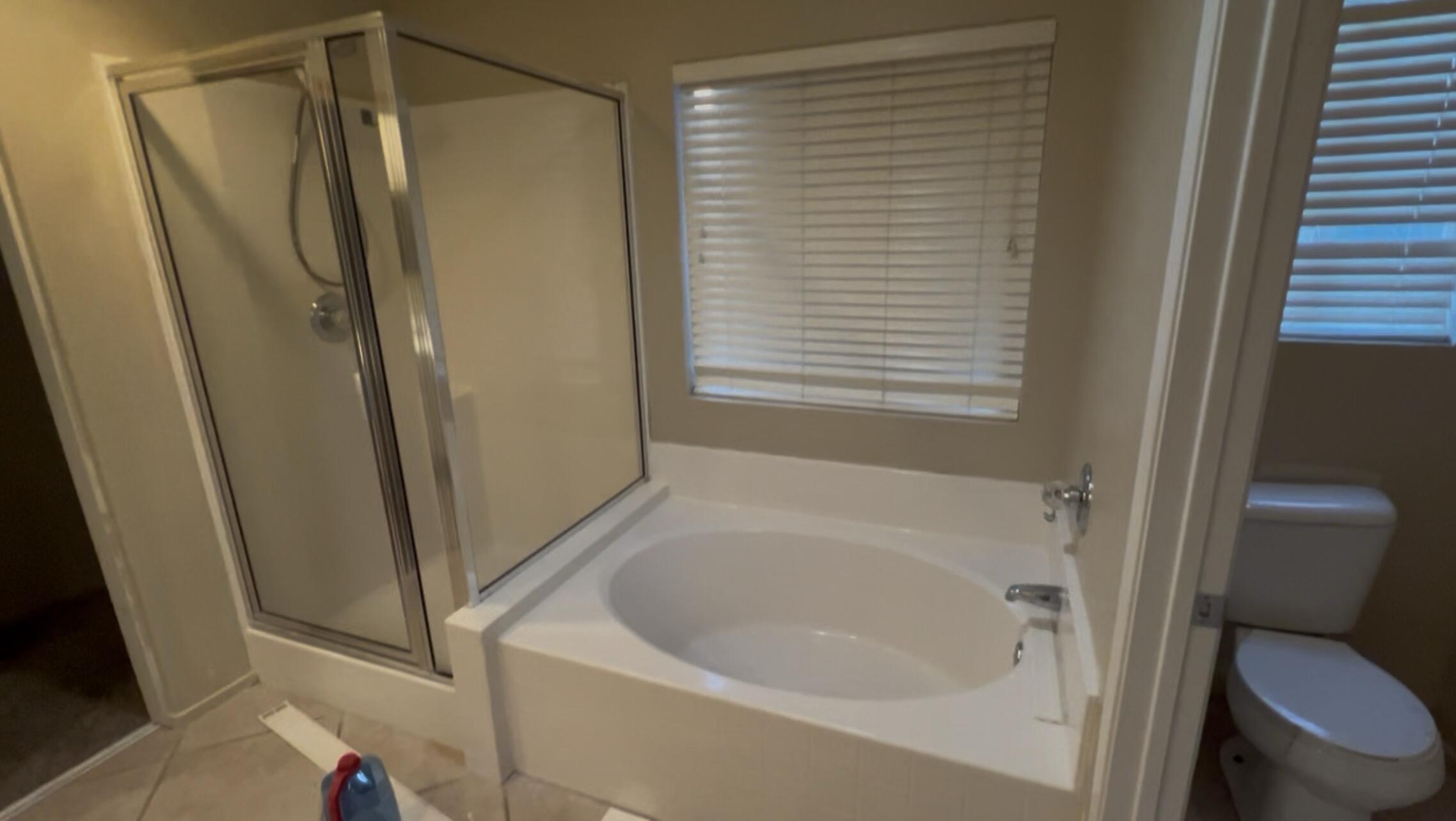 47750 Mirage Way Indio, CA 92201 - Photo 24 of 26 a bathroom with a tub and a toilet