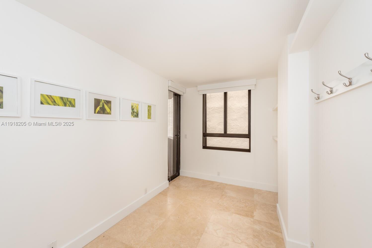 141 Crandon Boulevard, Unit 235 Key Biscayne, FL 33149 - Photo 13 of 25 a view of an empty room with a window