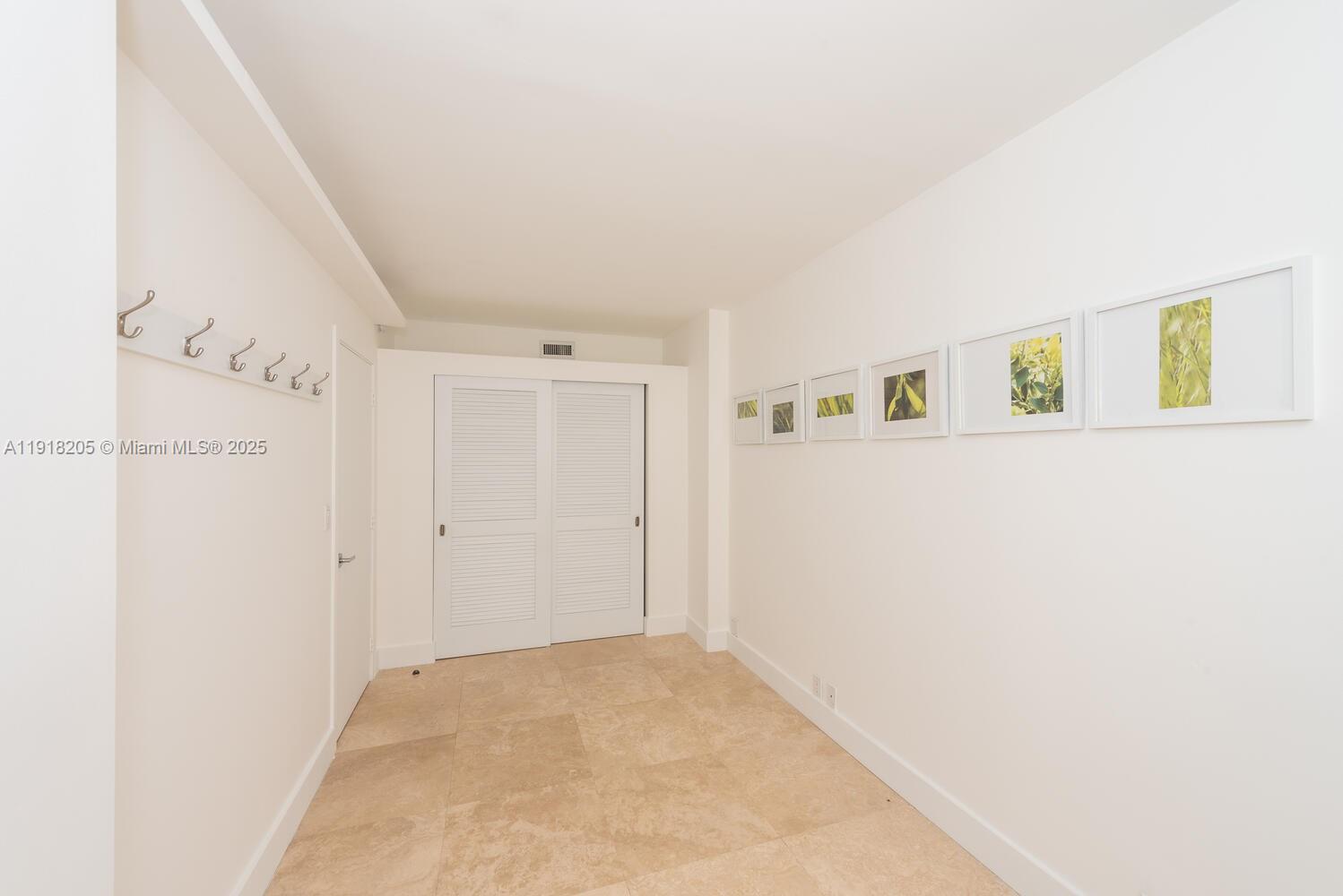 141 Crandon Boulevard, Unit 235 Key Biscayne, FL 33149 - Photo 15 of 25 a view of a hallway with closet