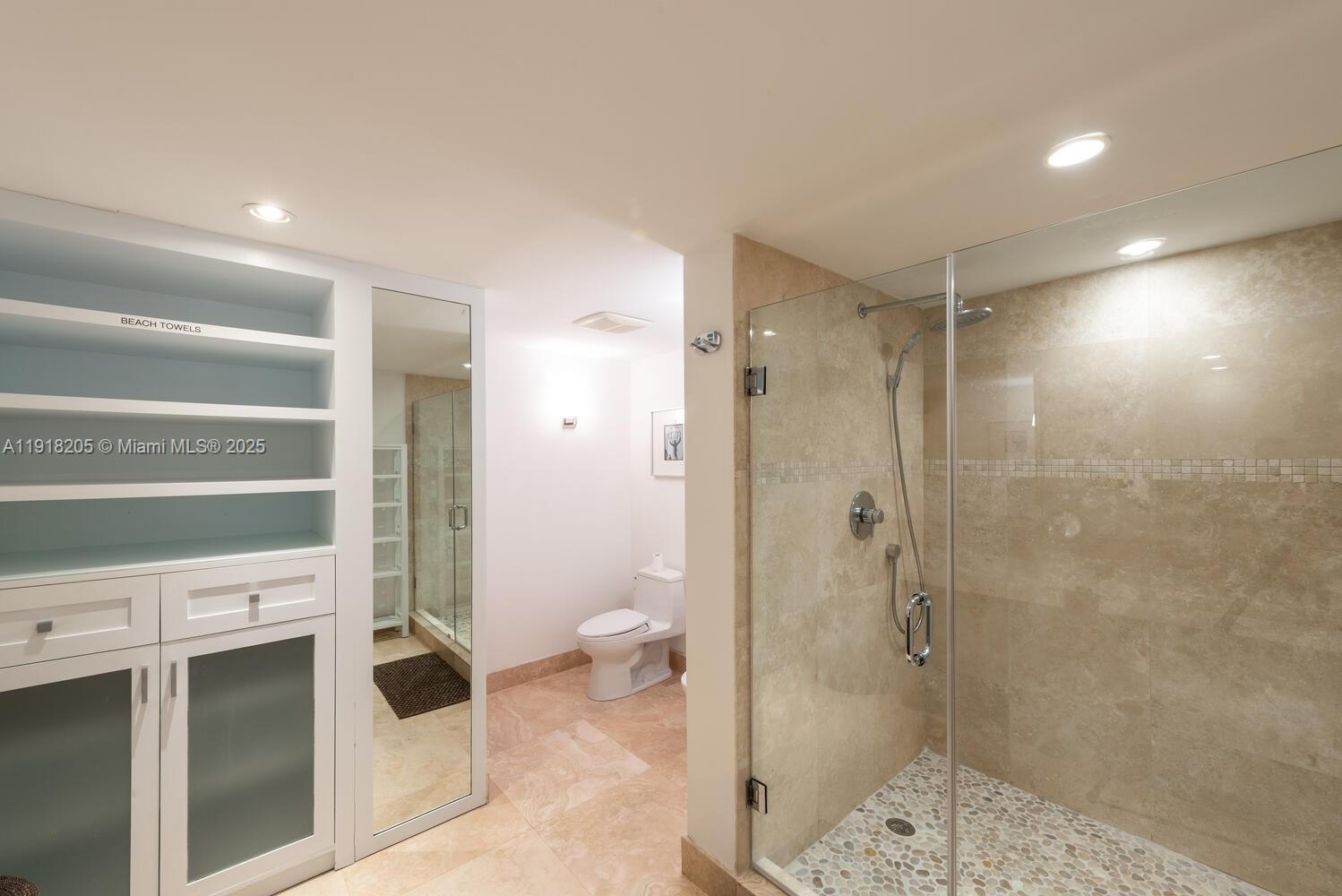 141 Crandon Boulevard, Unit 235 Key Biscayne, FL 33149 - Photo 23 of 25 a bathroom with a shower and a toilet