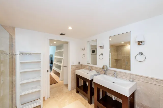 a bathroom with a sink vanity and a mirror