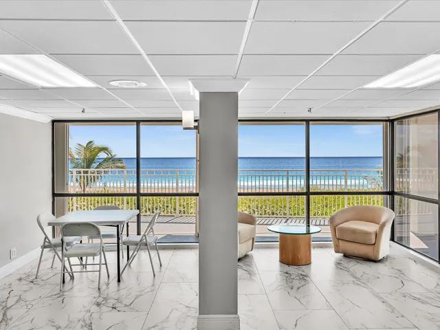 a view of a swimming pool with a lounge chair