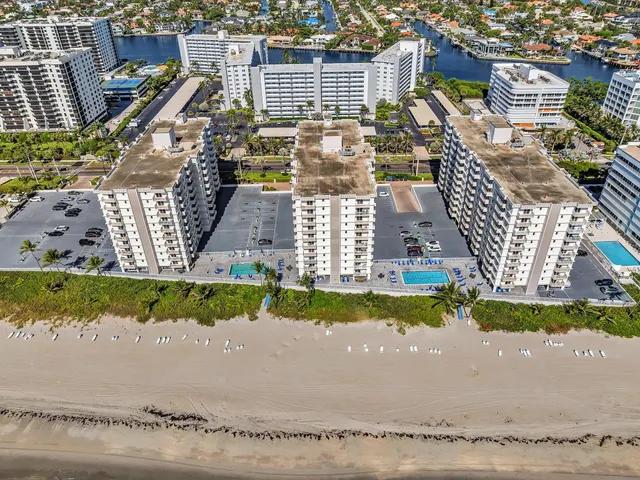 a kitchen with cabinets appliances and wooden floor